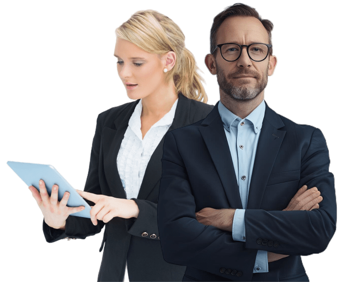 A man and woman in business attire, with the woman holding a tablet.